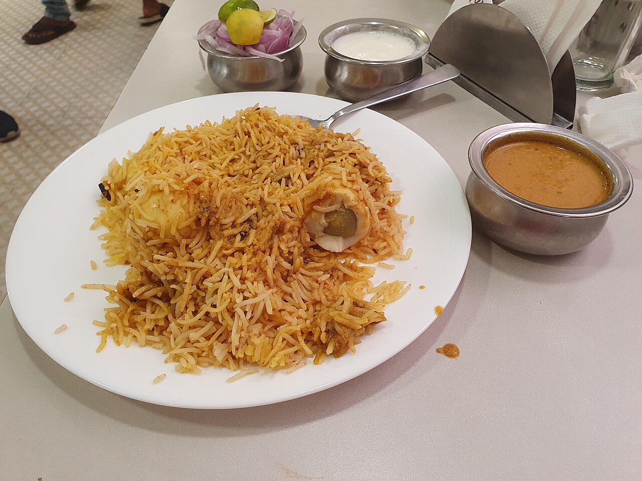 Egg dum biryani with halved boiled eggs over saffron rice
